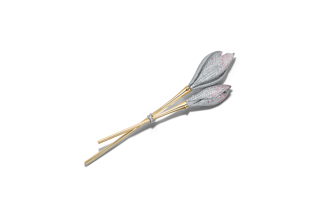 Tiffany & Co. Brooch in 18k yellow gold and platinum with round pink and white diamonds, over eight total carats