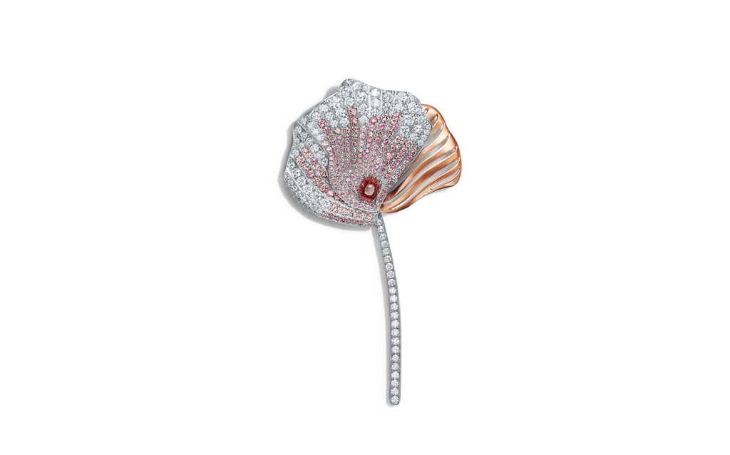 Tiffany & Co. Brooch in platinum and rose gold with an unenhanced cushion-cut orange sapphire of over three carats, round pink diamonds, over six total carats, and round brilliant diamonds